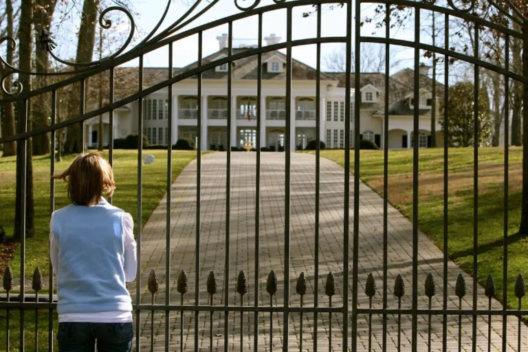 Standing behind the gate at Alan Jackson's house in Nashville, TN.