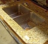 This granite sink has a chip, but it would be perfect for a<br /> laundry or potting shed. granite-counter-and-sink.jpg