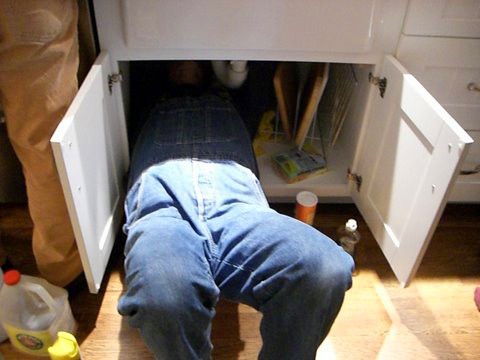 plumber-working-under-the-sink